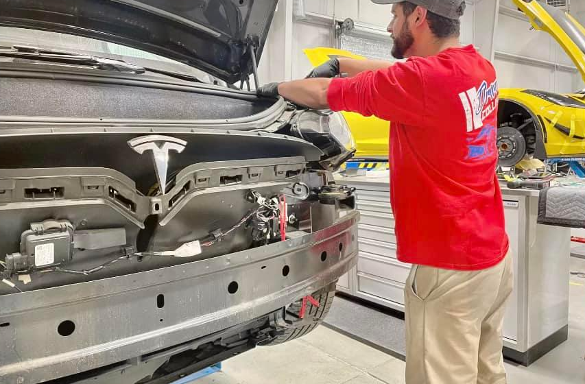 Driven Collision Technician Working on Tesla